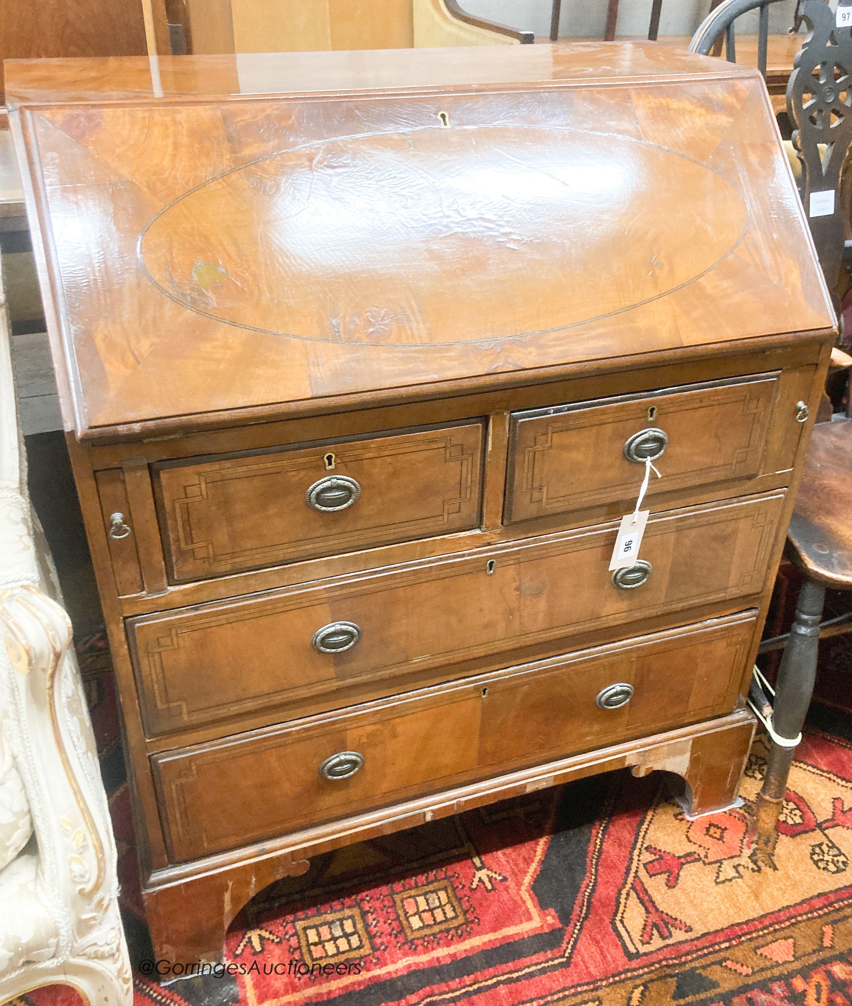 An early 20th century walnut bureau, width 66cm, depth 45cm, height 93cm